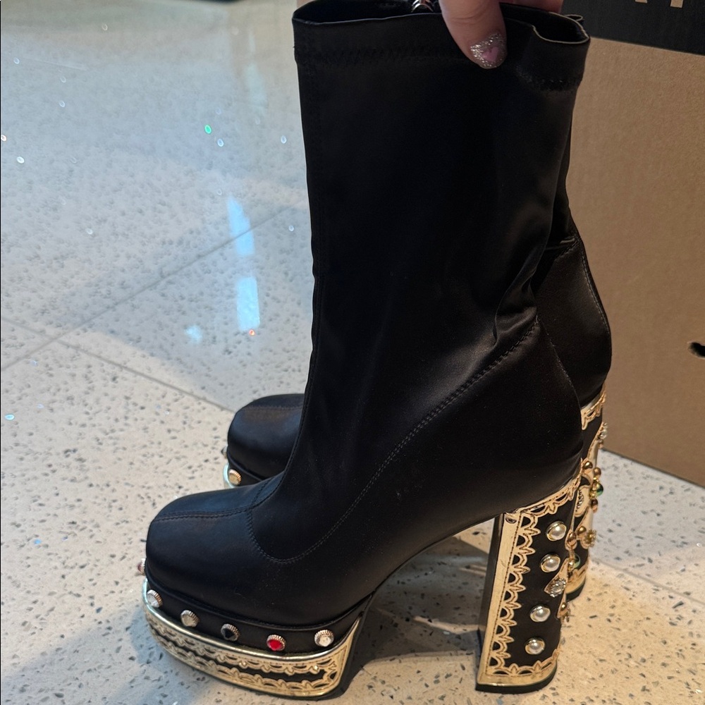 Chic Black Heeled Boots with Gold Embellishments